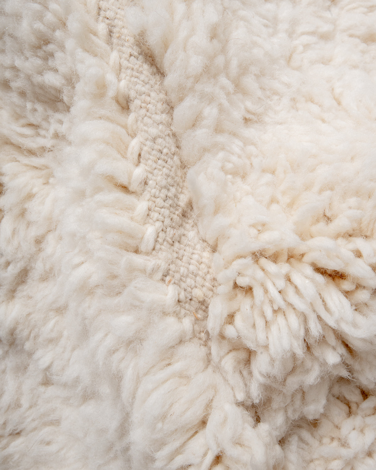 Modern, designer, handcrafted Berber rug from Morocco. Beniourain carpet with minimalist design, natural wool pile and a fluffy texture.